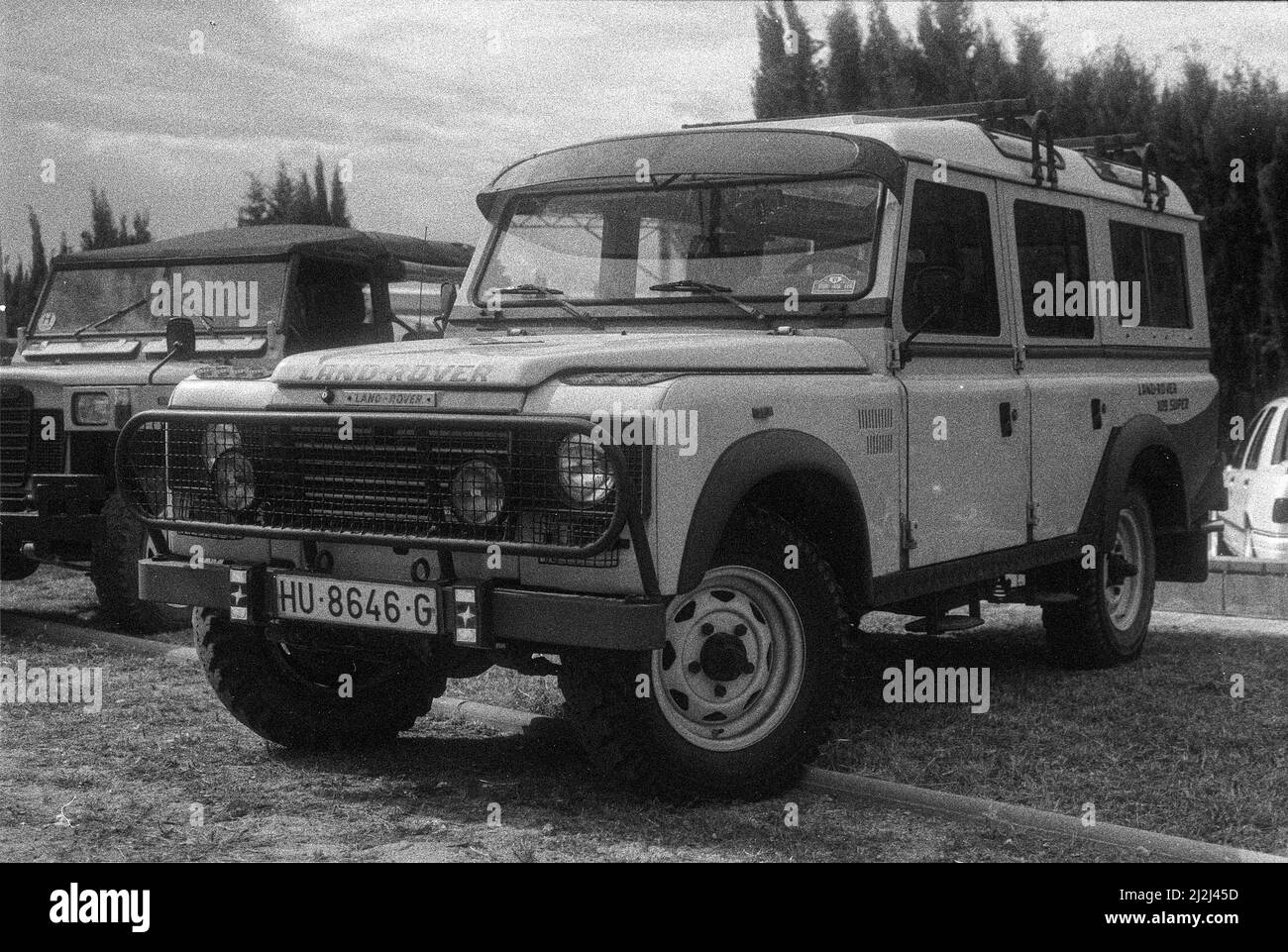A closeup of a classic and old typical 4x4 off-road car, Land Rover in  grayscale Stock Photo