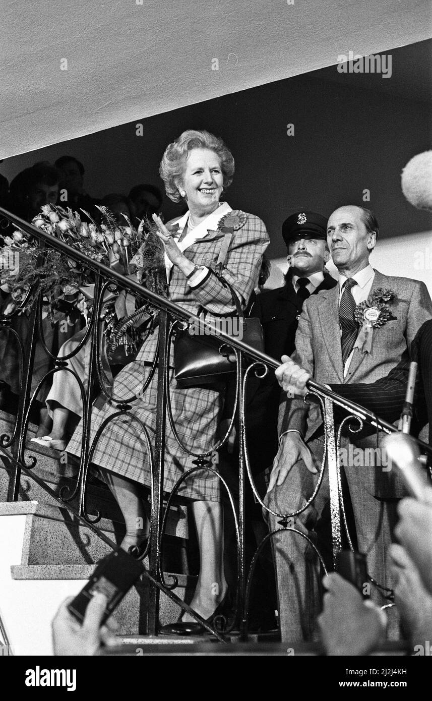 Prime Minister Margaret Thatcher and Conservative Party chairman, Norman Tebbit, celebrate winning a third term in government for the Conservative Party, from a window at Conservative Central Office in Smith Square, Westminster. 12 June 1987. Stock Photo