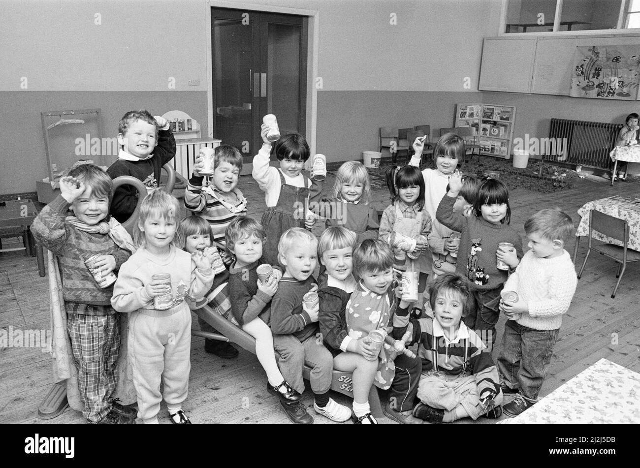 POP stars... Youngsters at the new Gledholt Methodist playgroup are seen with the soft drinks prizes awarded to the group by St Clement's fizzy drinks in a competition run by the Pre-School Playgroups' Association called Play Safe Week.  10th November 1988. Stock Photo