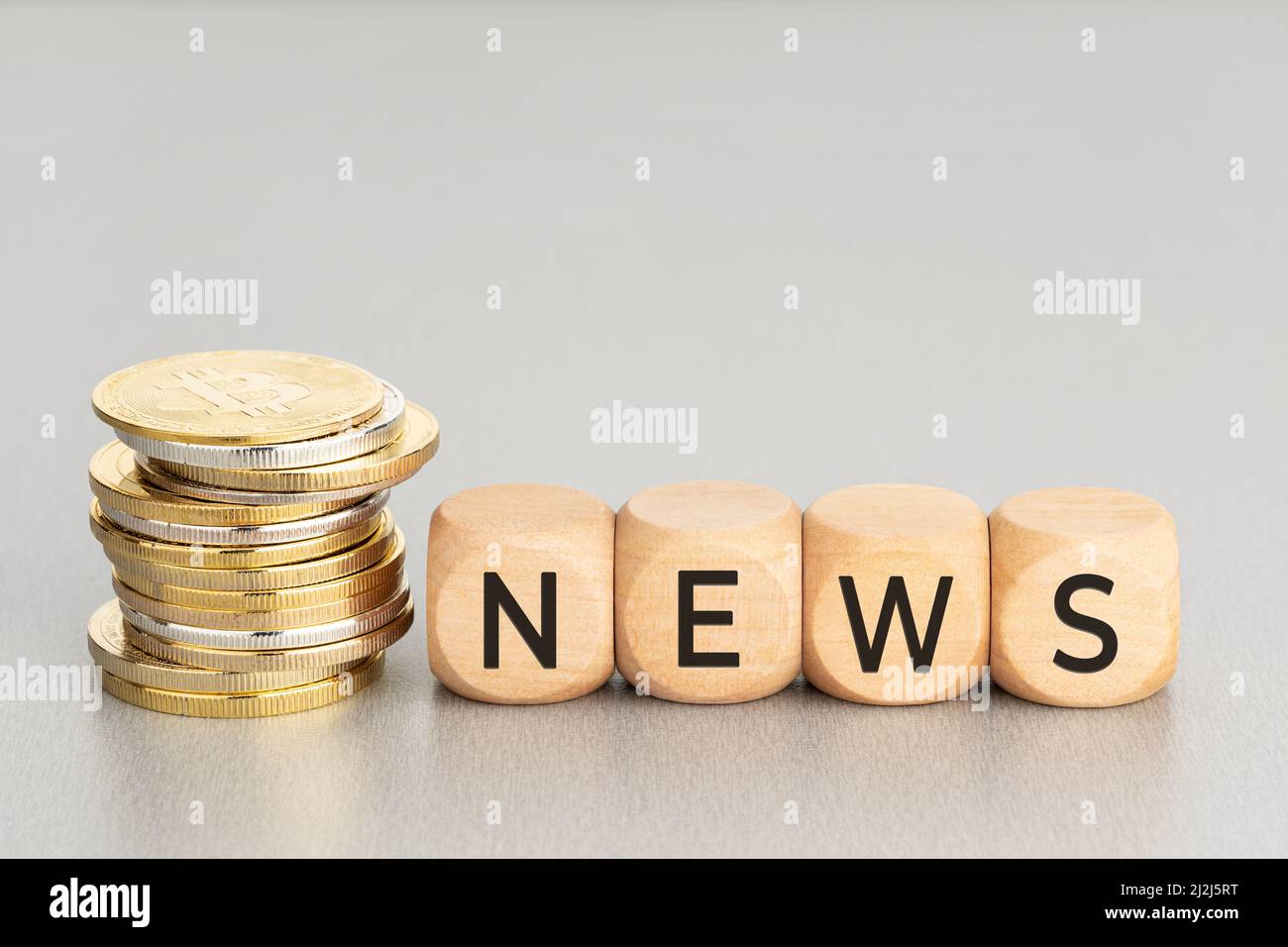 Cryptocurrency News concept. Stacked crypto coins and wooden blocks with  text. Copy space Stock Photo - Alamy