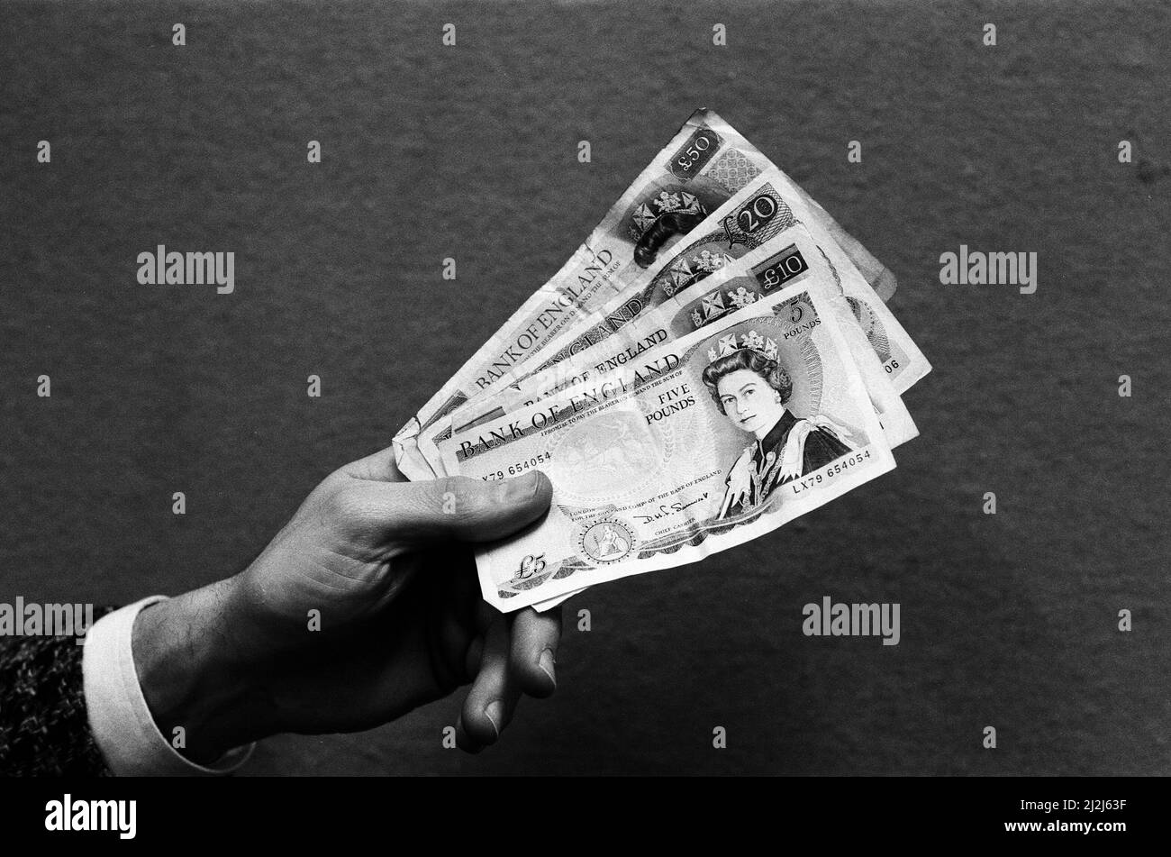 A handful of bank notes. 24th February 1987. Stock Photo