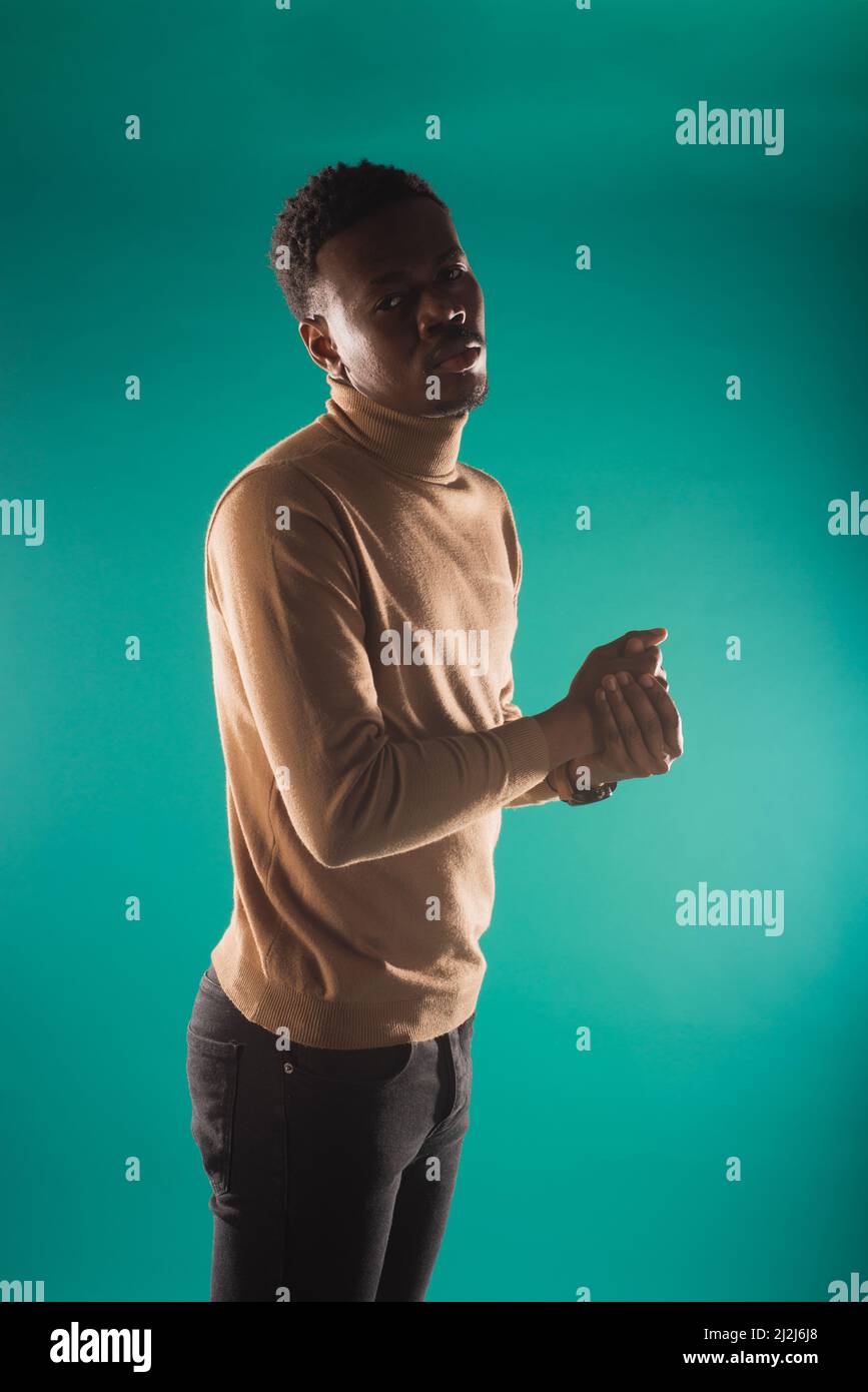 Handsome and attractive black male is having a casual style while