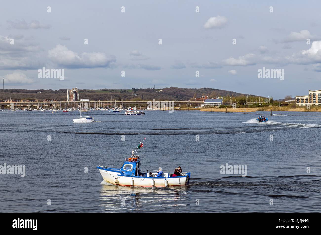 Boats out on Cardiff Bay lake on a sunny April day. Stock Photo