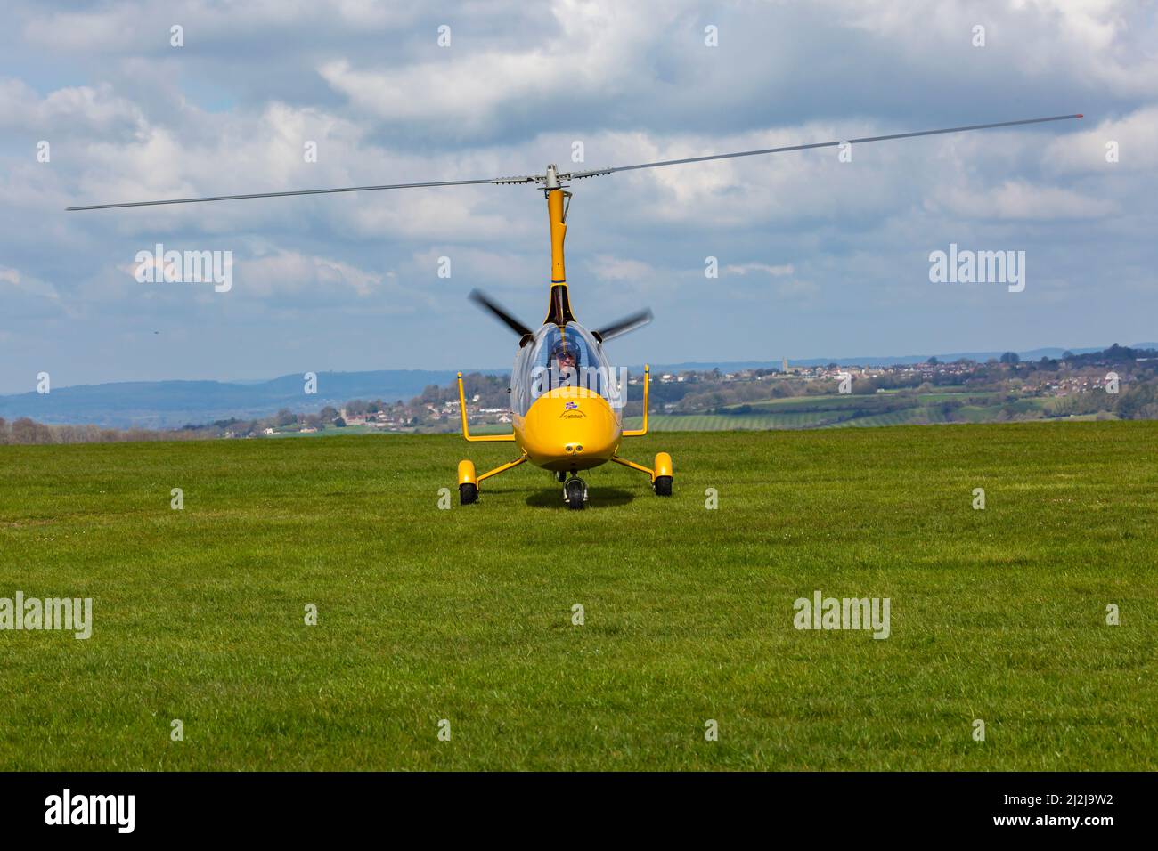 Compton Abbas, Dorset UK. 2nd April 2022. UK weather: light aircraft , including some vintage, take to the skies on a sunny, but chilly day at Compton Abbas Airfield in Dorset. Gyroplane coming in to land. Credit: Carolyn Jenkins/Alamy Live News Stock Photo