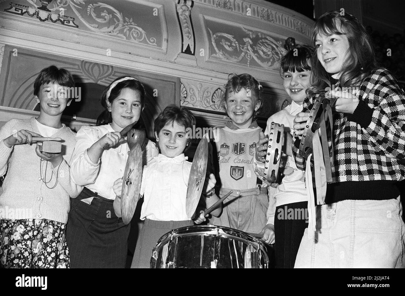 The Cowersley Junior School percussionists, from left, Alison Sykes, Antonia Tweed, Kirsty Gentry, Jill Irving, Lindsay Ashcroft and Carole Pollard, during the Kirklees Primary School Music festival at Huddersfield Town Hall. 23rd March 1988. Stock Photo
