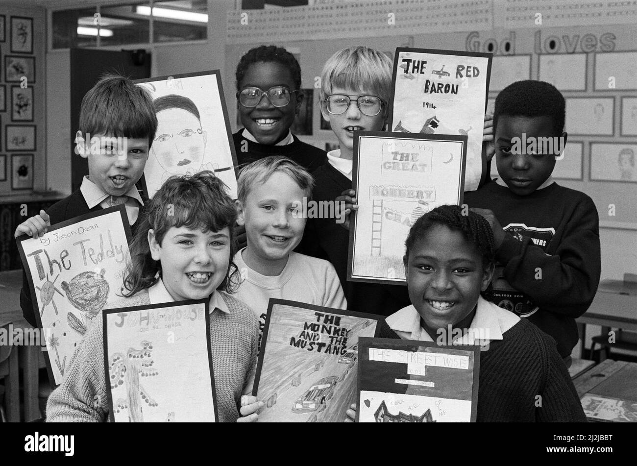 Booked for success... these youngsters won Bradley Junior School's competition to design a book cover. The contest was staged as part of the National Book Week which aims to promote reading among children. From left (back) are: Jason Dean, Georgina Miller, Christopher Beresford, and Jonathan Scoon. Front are Tracy Childs, Daniel Bright and Lorraine Stoddart. Stacy Samuels, not pictured, was also a winner and they all received book tokens as prizes. Some 200 children took part and book stalls have been set up in the school. 11th October 1988. Stock Photo