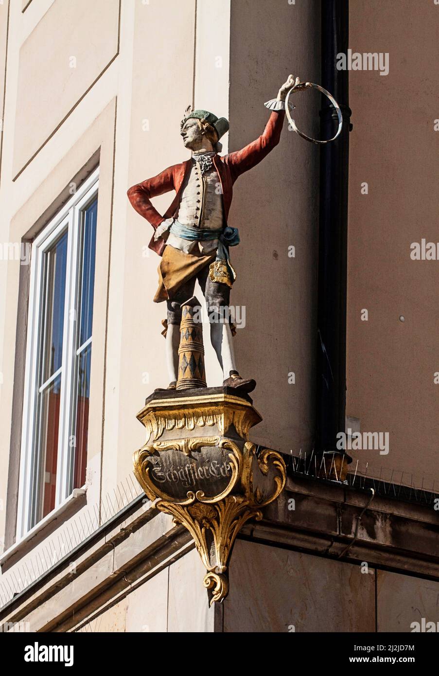 Munich, Cooper's corner, traditional cooper figure with the ancient costume of the barrel maker confraternity in city center Stock Photo