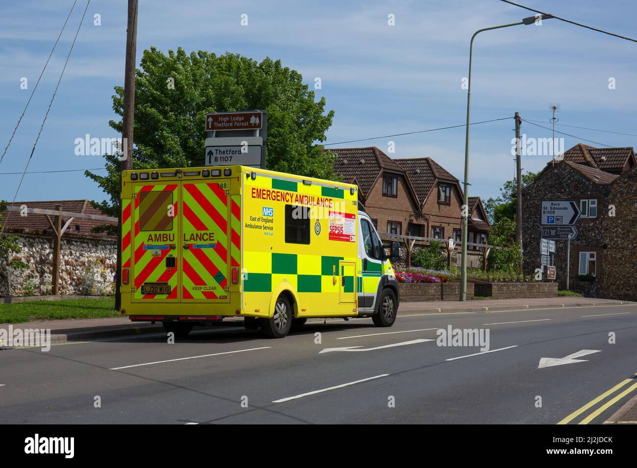 A closeup from behind of an emergency ambulance going down Thetford