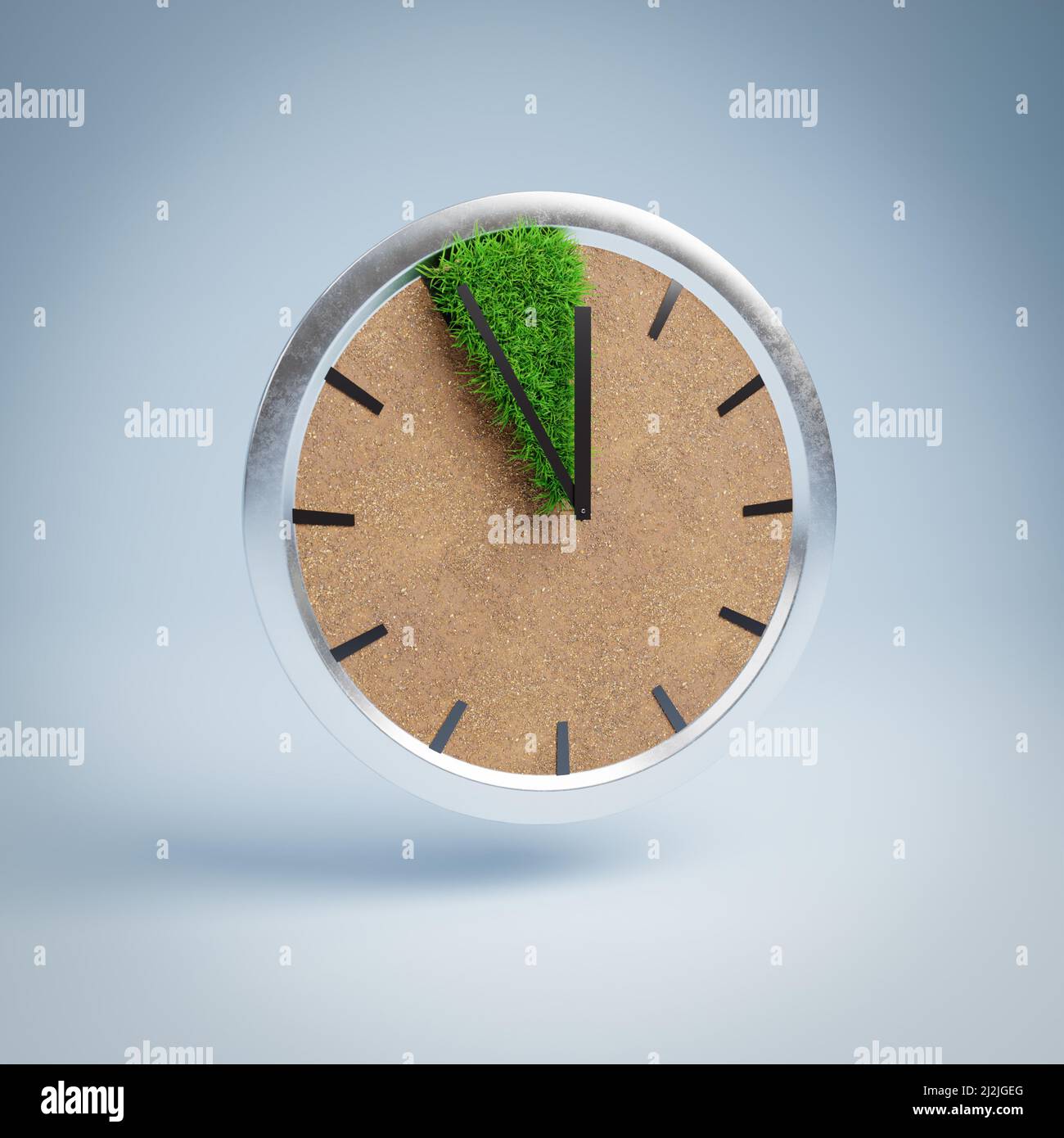 Time is running out for acting against the climate crisis. It is 5 minutes to twelve. Concept shot showing a clock with arid soil and a small patch of Stock Photo