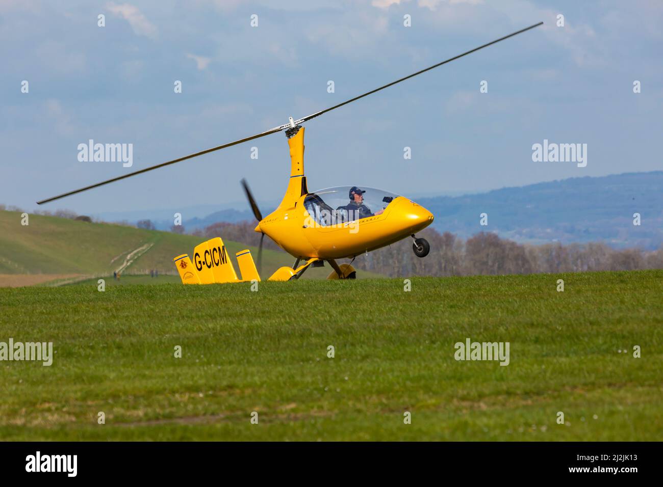 Compton Abbas, Dorset UK. 2nd April 2022. UK weather: light aircraft , including some vintage, take to the skies on a sunny, but chilly day at Compton Abbas Airfield in Dorset. Gyroplane coming in to land. Credit: Carolyn Jenkins/Alamy Live News Stock Photo