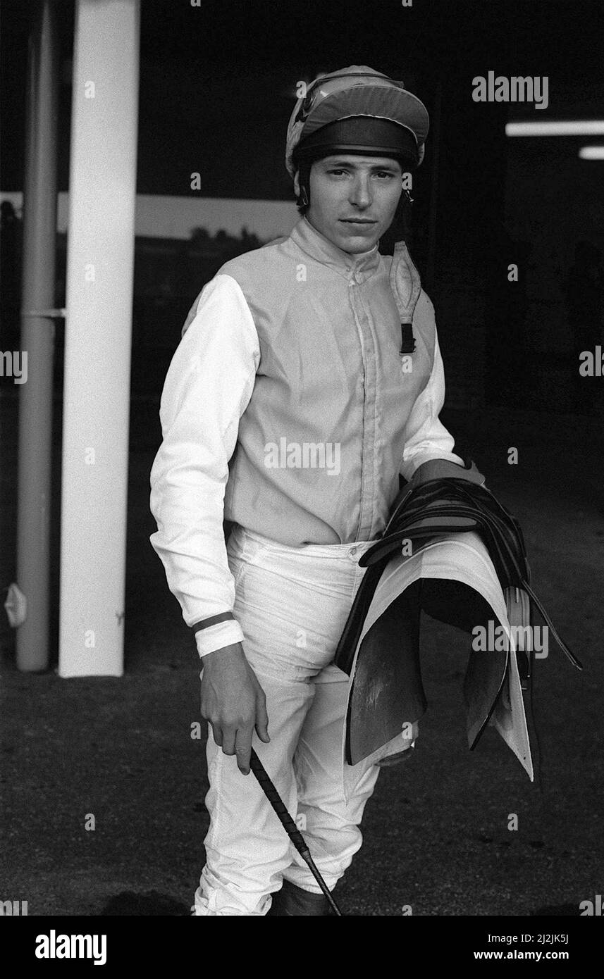 American jockey Steve Cauthen carrying his saddle and whip at Kempton