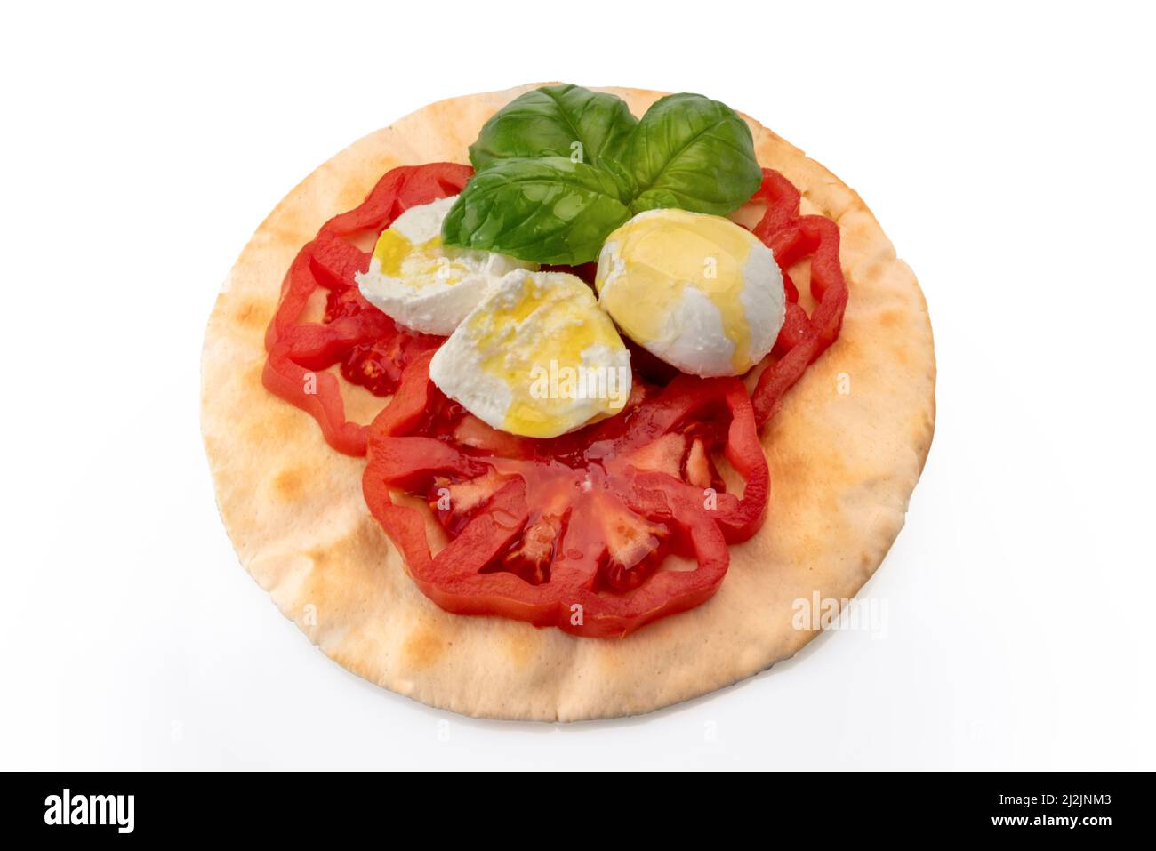 Caprese salad with tomato mozzarella olive oil and basil leaves on