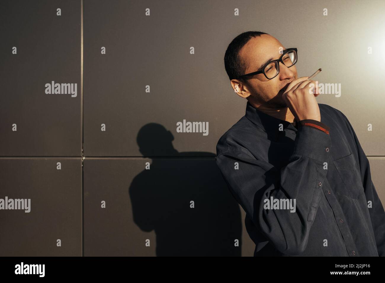 Man smoking a white paper joint close up Stock Photo Alamy