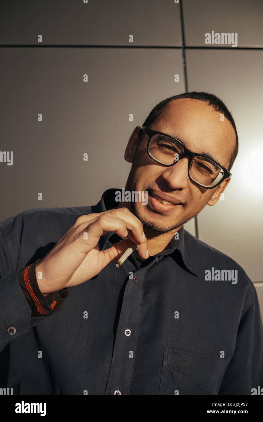 Man smoking a white paper joint close up Stock Photo Alamy