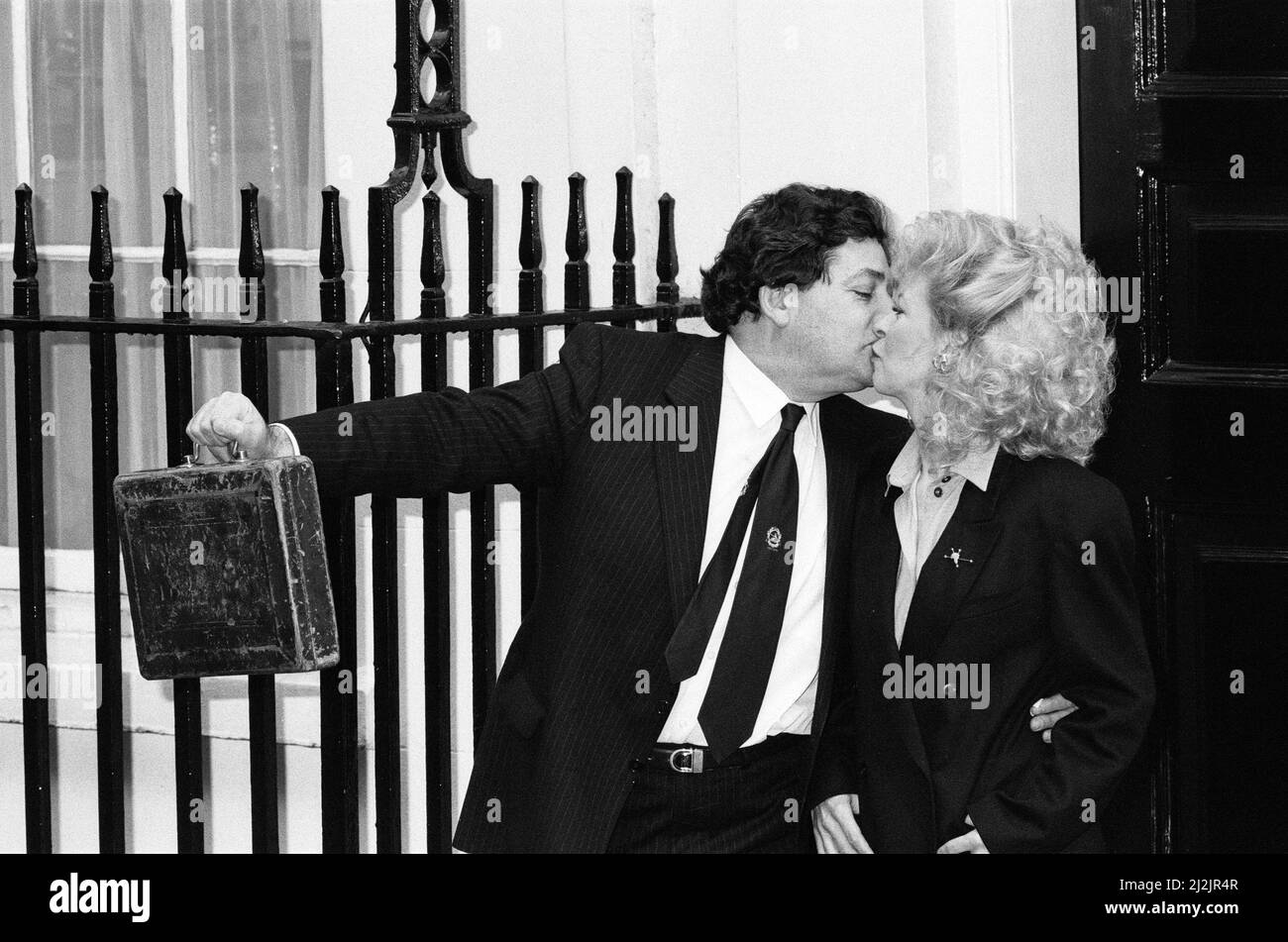 The Chancellor of the Exchequer, Nigel Lawson, and his wife Therese. Pictured on Budget Day, leaving Downing Street for the House of Commons. London. 15th March 1988. Stock Photo
