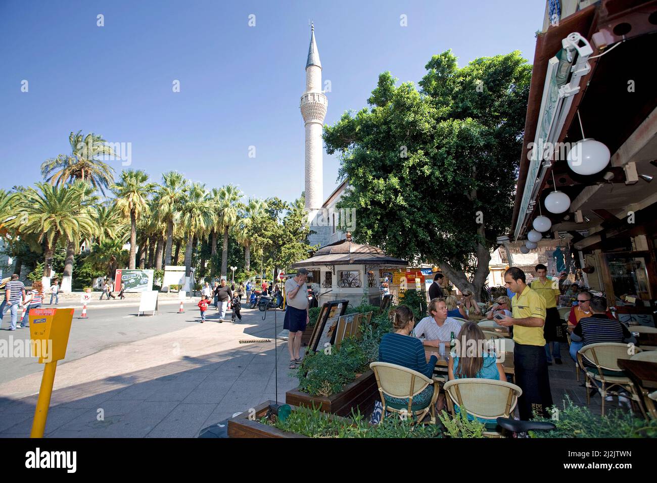 People in a harbour restaurant, harbour promenade of Bodrum, Turkey, Mediterranean Sea Stock Photo