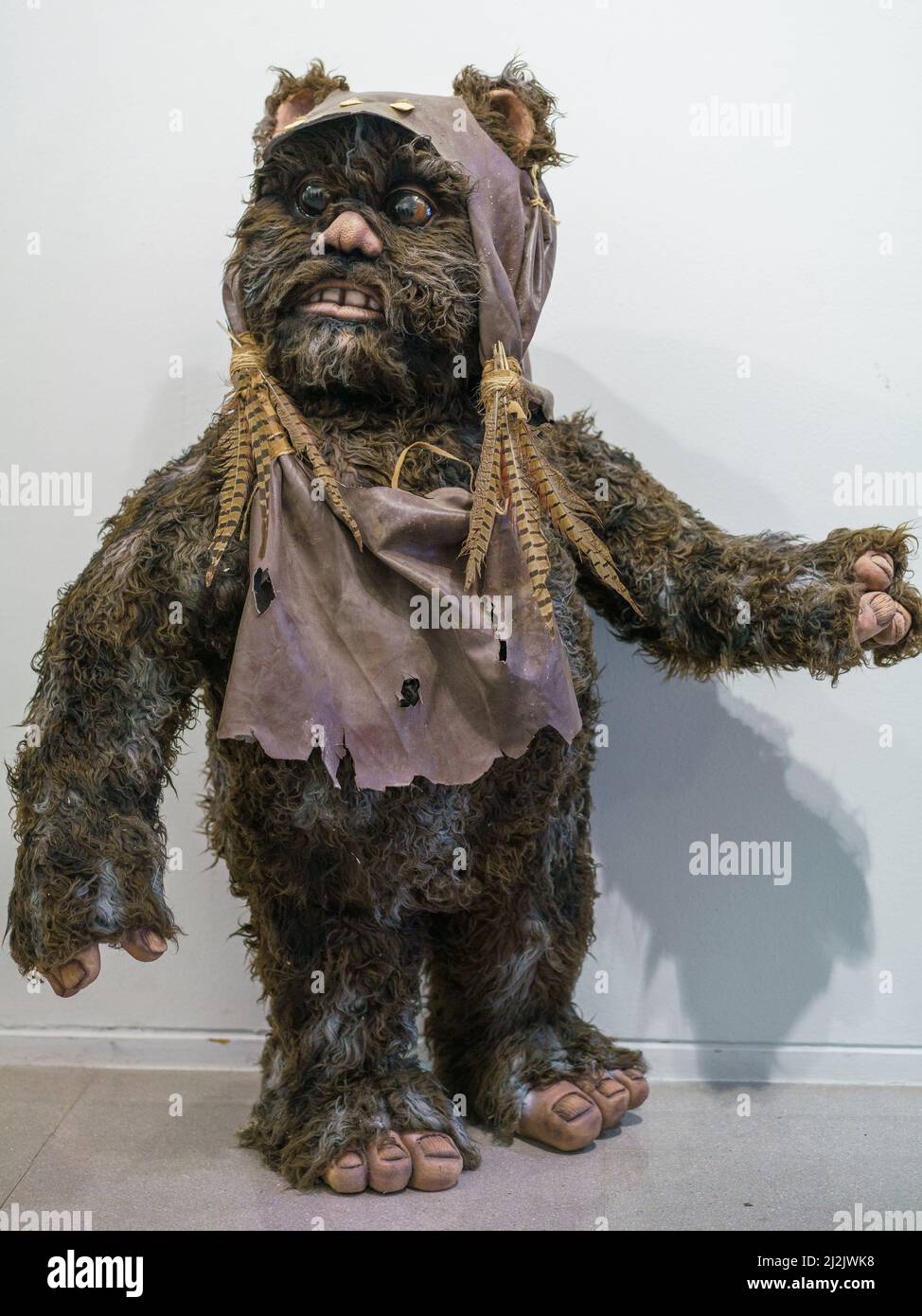 A figure of the character Ewok is exhibited during the exhibition of 'the Star Wars universe' by the sculptor Juan Villa at the Paco de Lucía exhibition hall in Madrid. The Star Wars universe can be visited for free until April 28 at the Paco de Lucía exhibition hall. The exhibited pieces are part of the work that this master craftsman is developing with his team for the future permanent exhibition Puerto Espacio, a science fiction project of his own. Stock Photo