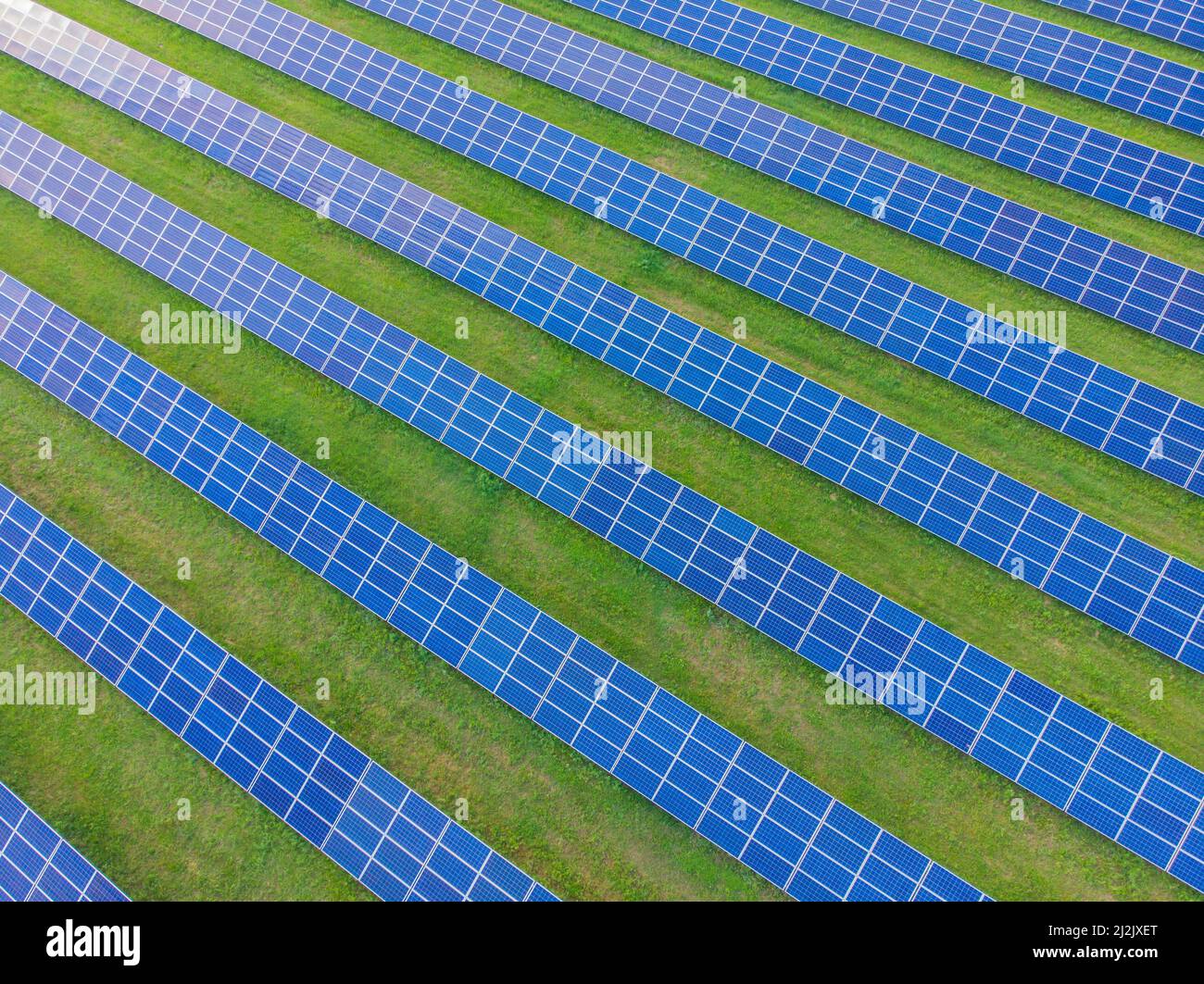 Metaaidc Solar Power Drone aerial view of a photovoltaic solar system. Metallic blue solar ...