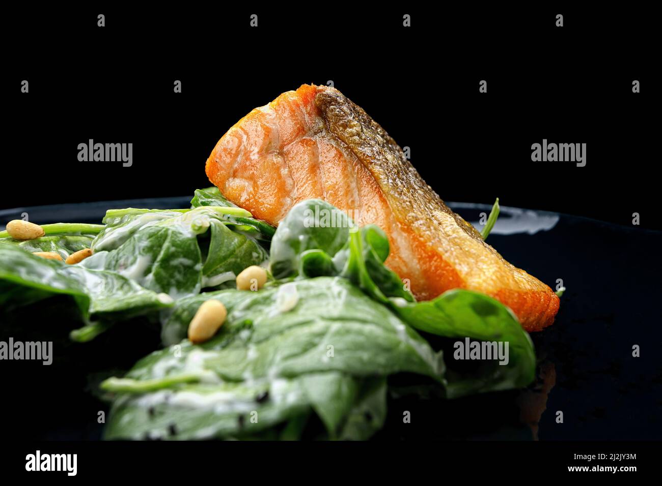 Grilled salmon fillet with herbs, on a dark background Stock Photo - Alamy