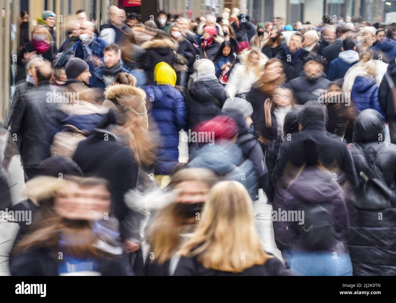 02 April 2022, Hessen, Frankfurt/Main: People walking along Frankfurt's central shopping mile, the Zeil (shot with longer exposure time and wipe effect). The new Corona regulations in Hesse, which have been in force since April 2, 2022, stipulate that masks and tests are only mandatory in particularly sensitive living areas such as hospitals and retirement homes. Photo: Frank Rumpenhorst/dpa Stock Photo