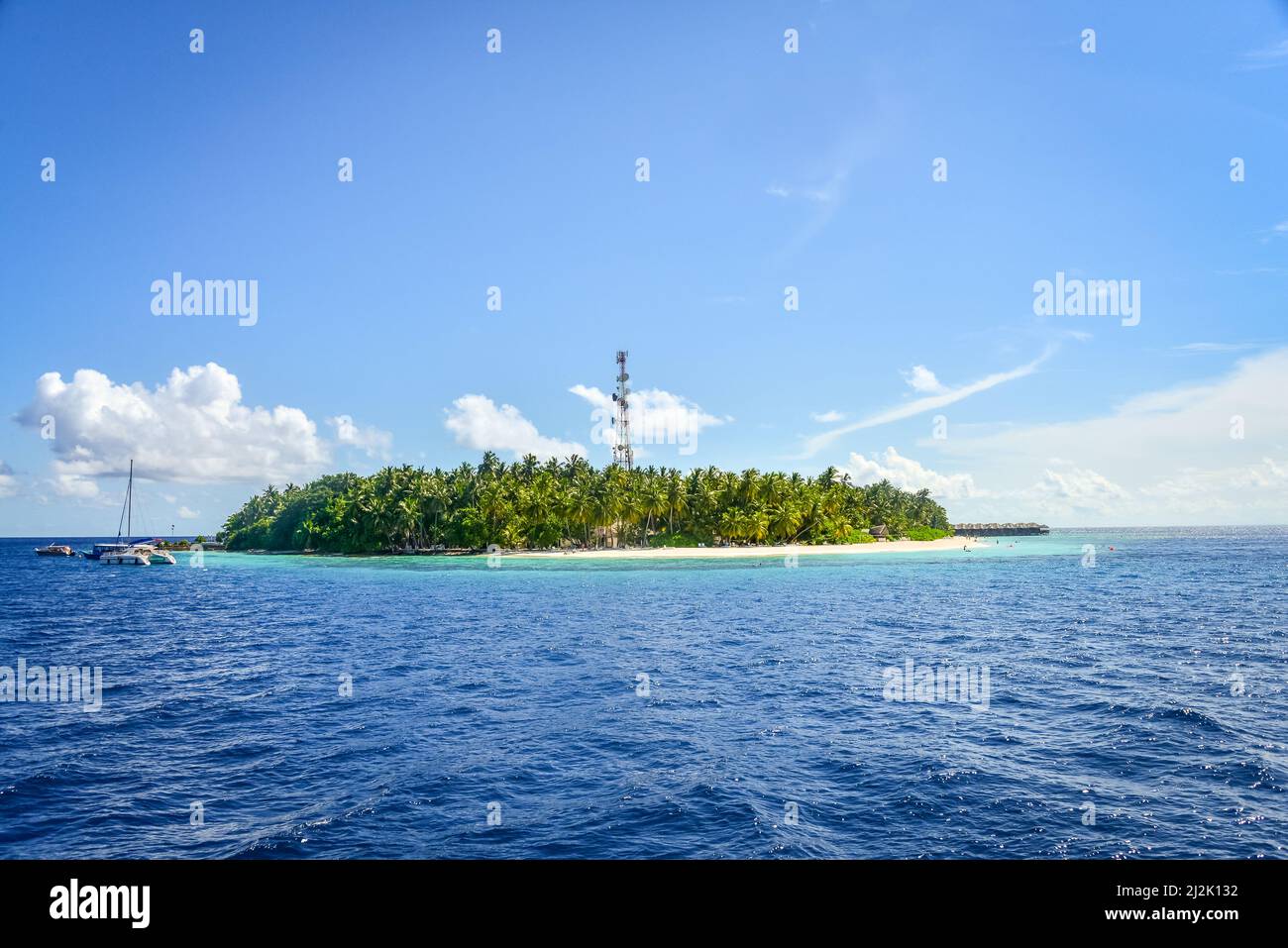 Boats anchored by Fihalhohi island, Maldives Stock Photo