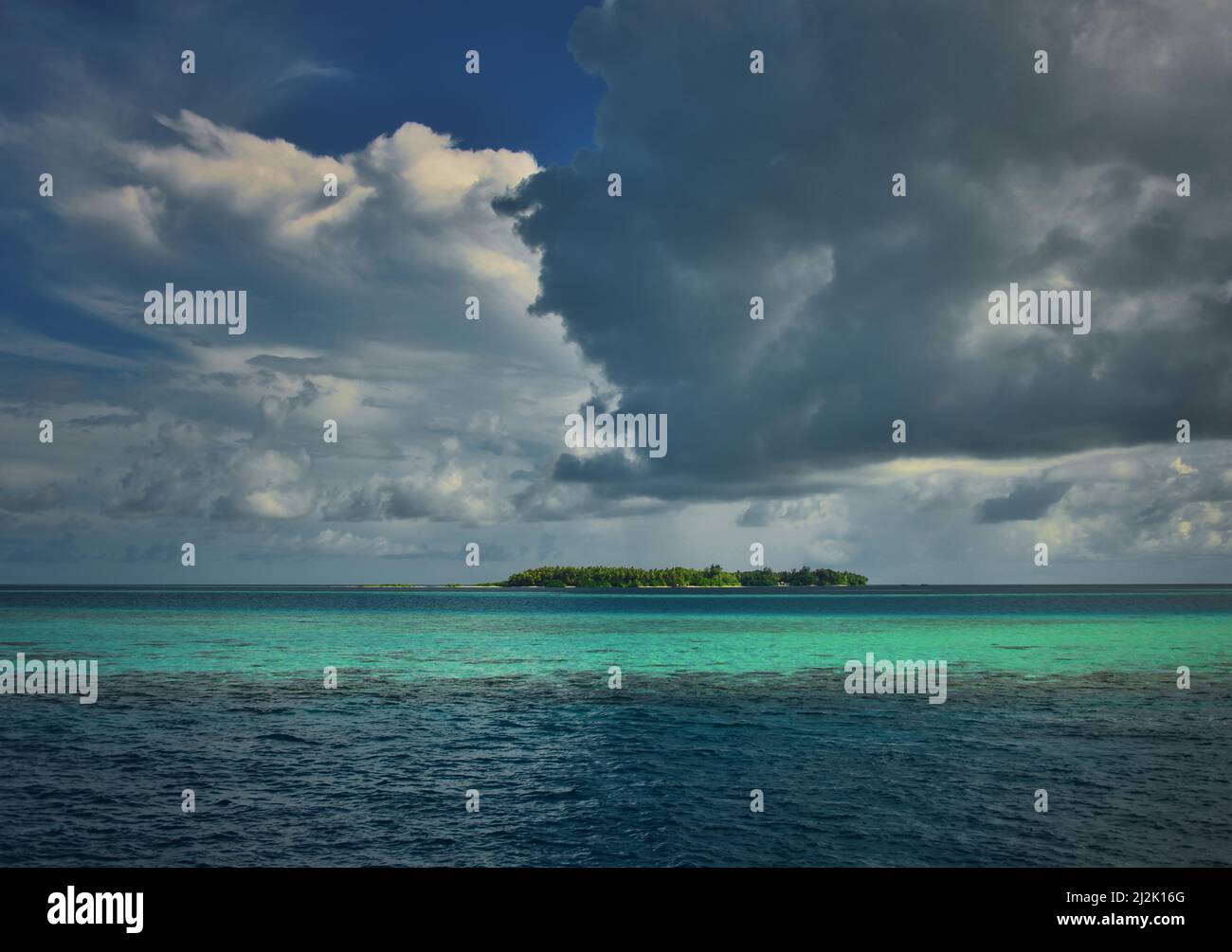 Storm clouds over a tropical island, Maldives Stock Photo