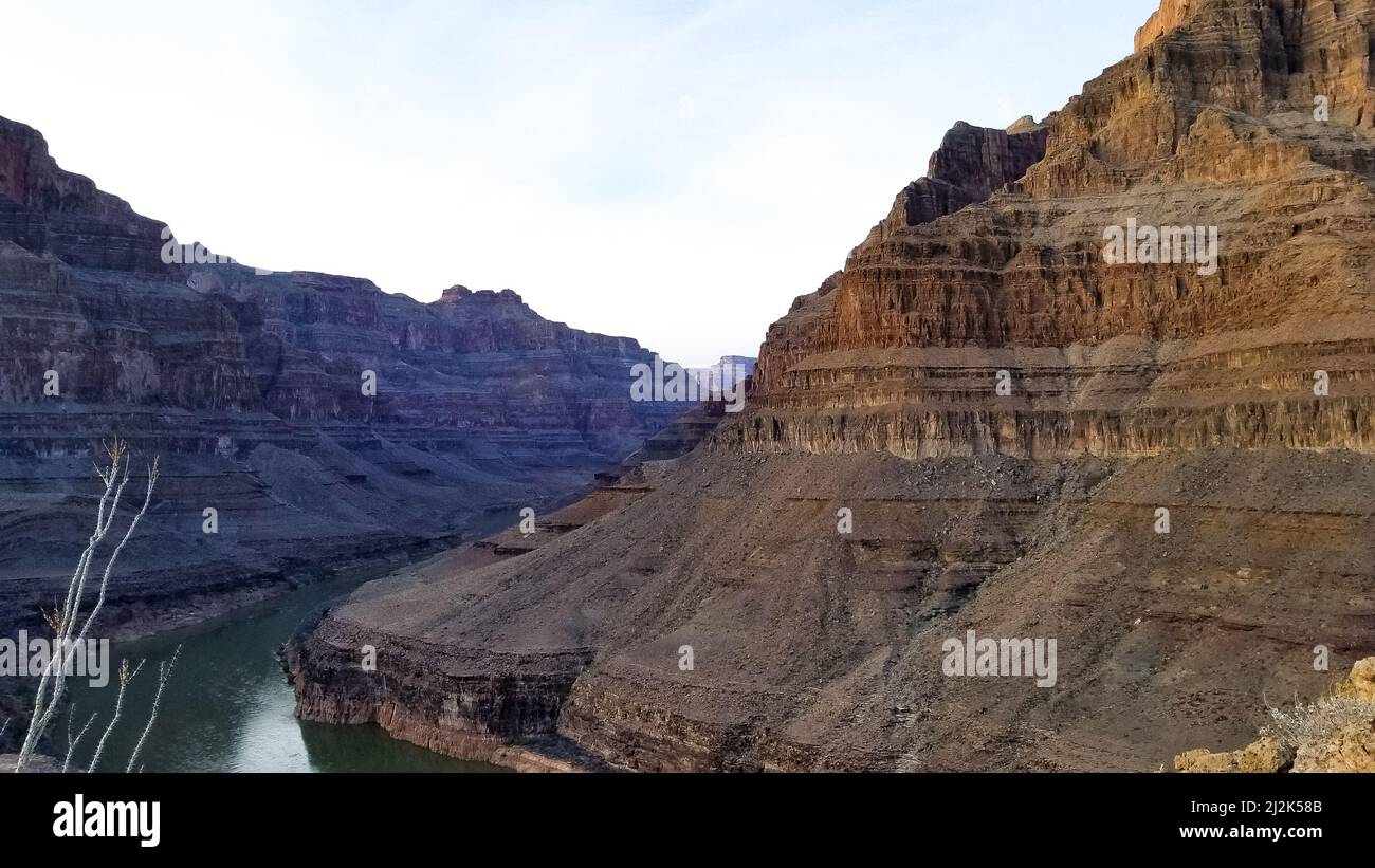 A scenic view of a river flowing through its rocky banks in the Grand ...