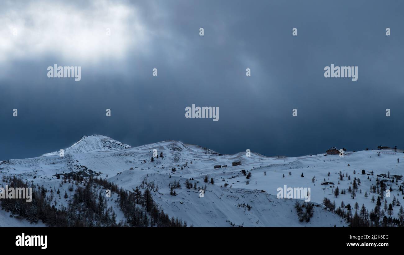 Clouds carrying snow in the italian alps Stock Photo - Alamy