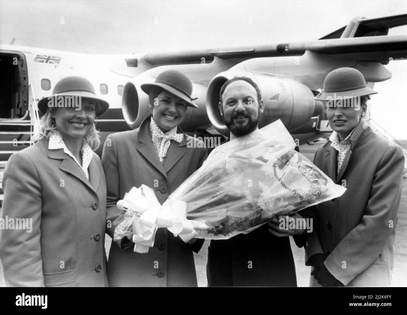 Steve Casey, pictured with left to right, Anne Liddle, Jeanette Jenkins and Linda Clough.  Dan-Air, the company accused of labelling cabin staff as sexually promiscuous, decided to send bouquets of flowers to its 600 stewardesses - including about 60 based at Newcastle.  The move was described as a gesture of goodwill by the airline, which is also giving £5,000 to a children's trust which organises flights for disabled and deprived youngsters.  The early St Valentine's Day gift was made after talks between management and cabin crew representatives of the Transport and General Workers' Union. Stock Photo
