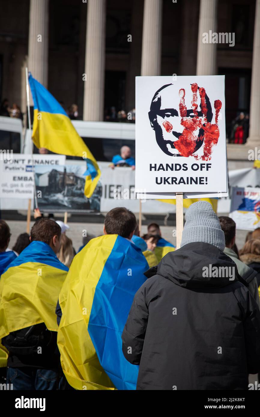 London, UK. 2 April 2022. Protesters are holding signs as people have gathered in Trafalgar Square to show solidarity with Ukraine and to call for an end of the war. Credit: Kiki Streitberger/Alamy Live News Stock Photo