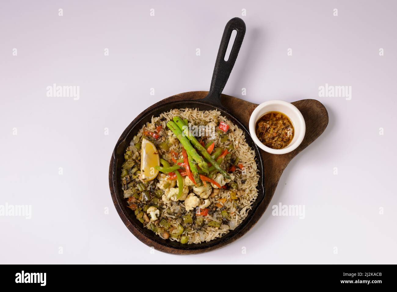 VEGETARIAN JAMBALAYA vegan rice in a dish top view on grey background