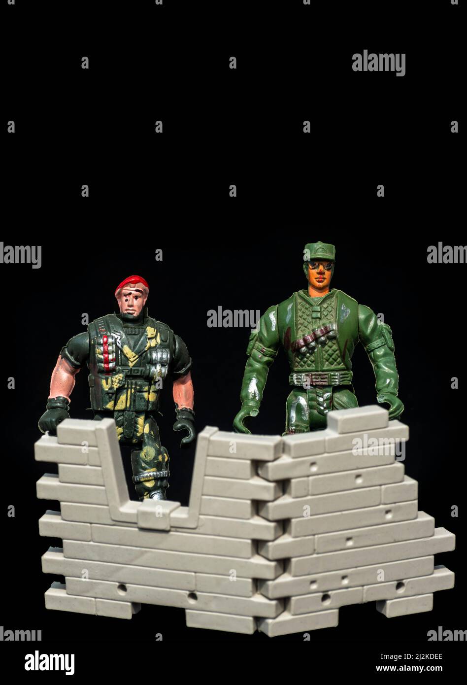 Plastic toy soldier defending territory. selective focus Stock Photo