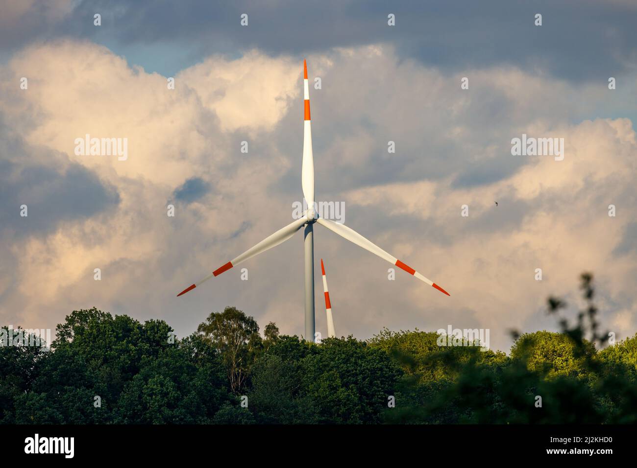 Wind turbine against a cloudly blue sky Stock Photo - Alamy