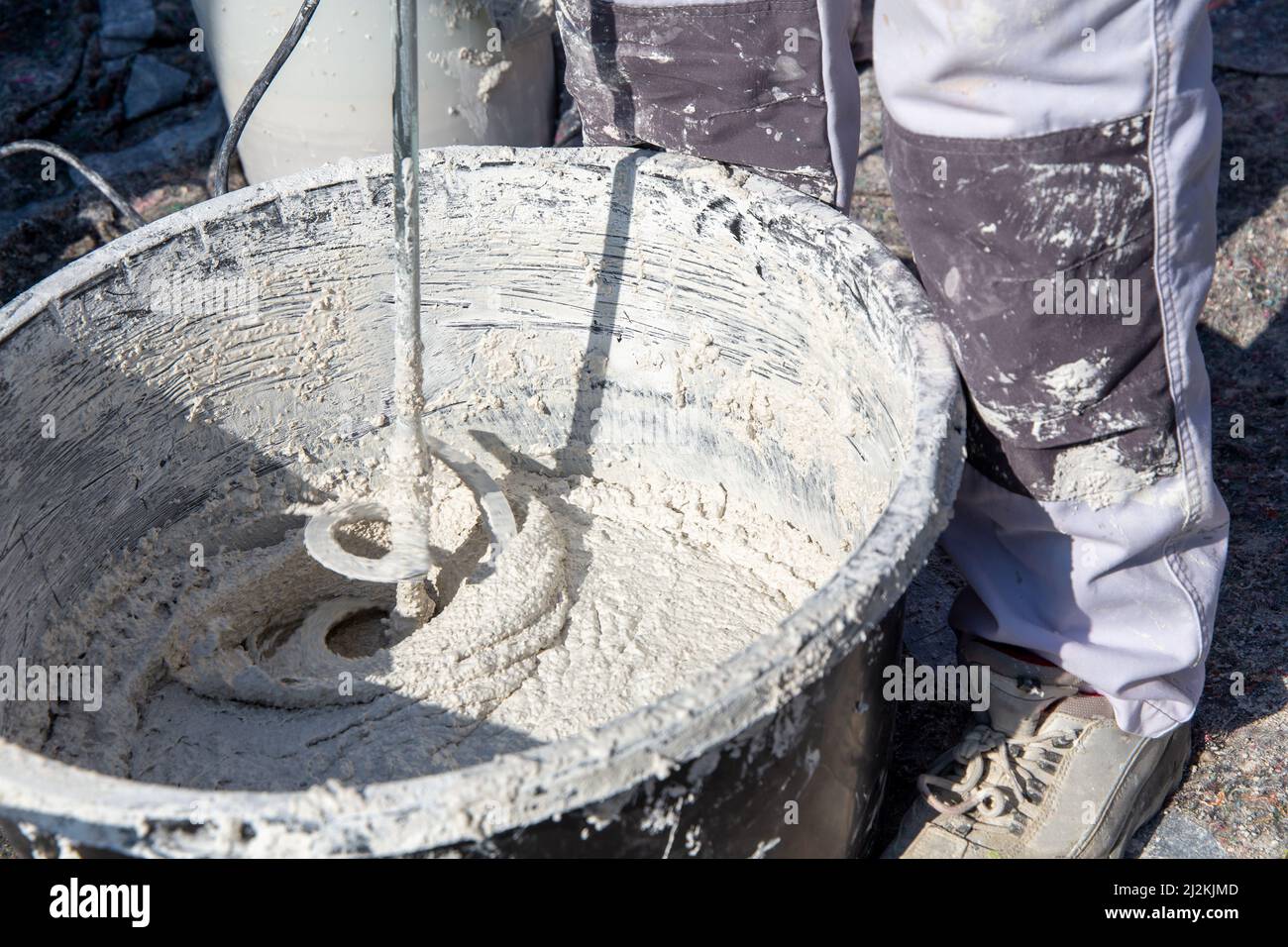 Plasterer mixing exterior plaster Stock Photo Alamy