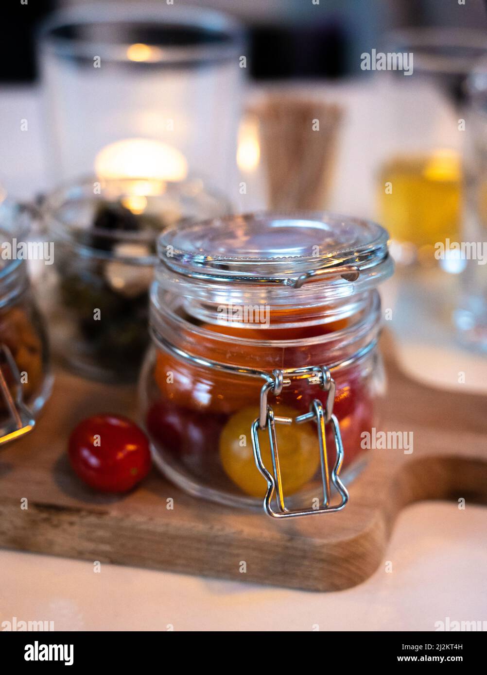 Glass jars with healthy party snacks served in bar, tasty appetisers