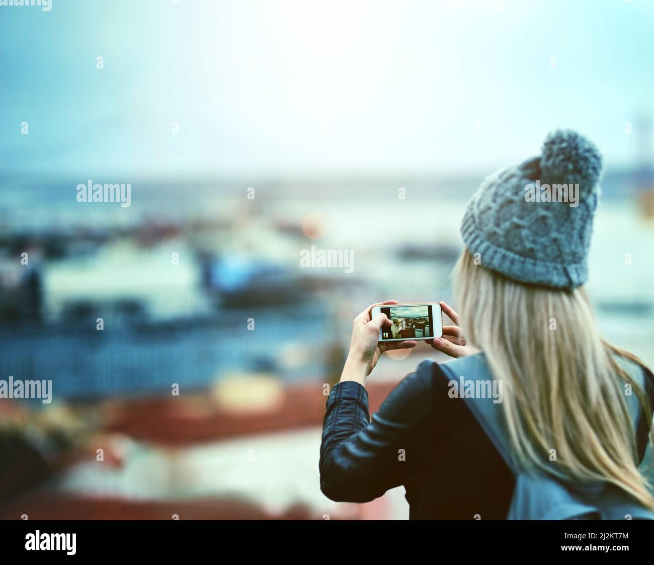 Woman looking at phone rear view hi-res stock photography and images ...