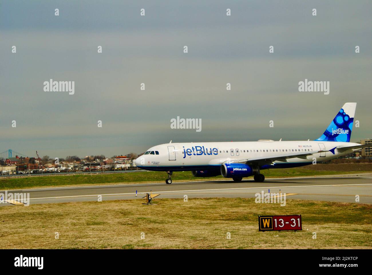 JetBlue plane on runway at La Guardia airport ready for take off. Stock Photo
