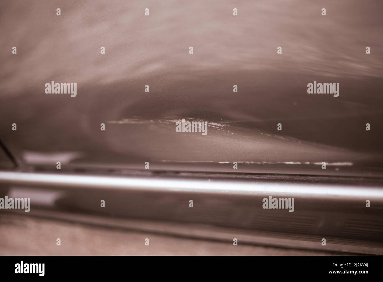 Dent with a scratch on the car door after the accident. Accident and car repair Stock Photo Alamy