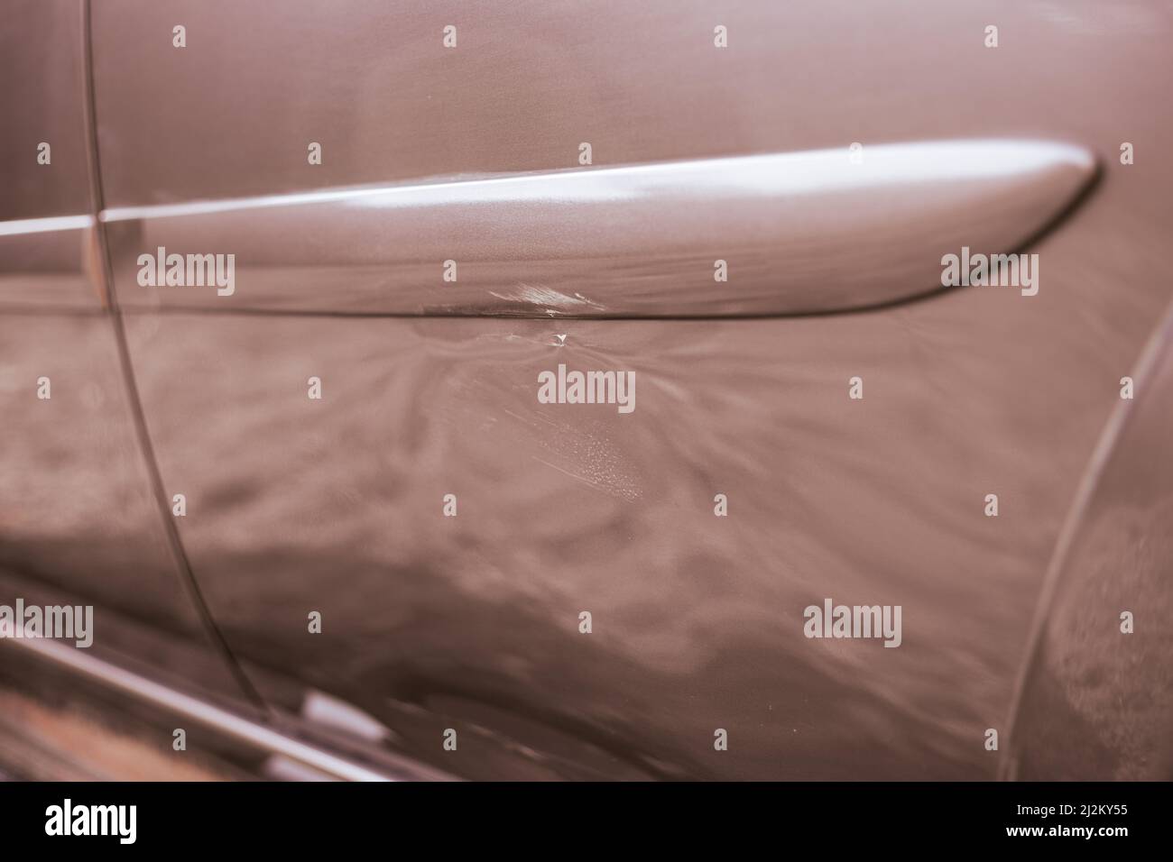 Dent with a scratch on the car door after the accident. Accident and car repair Stock Photo Alamy