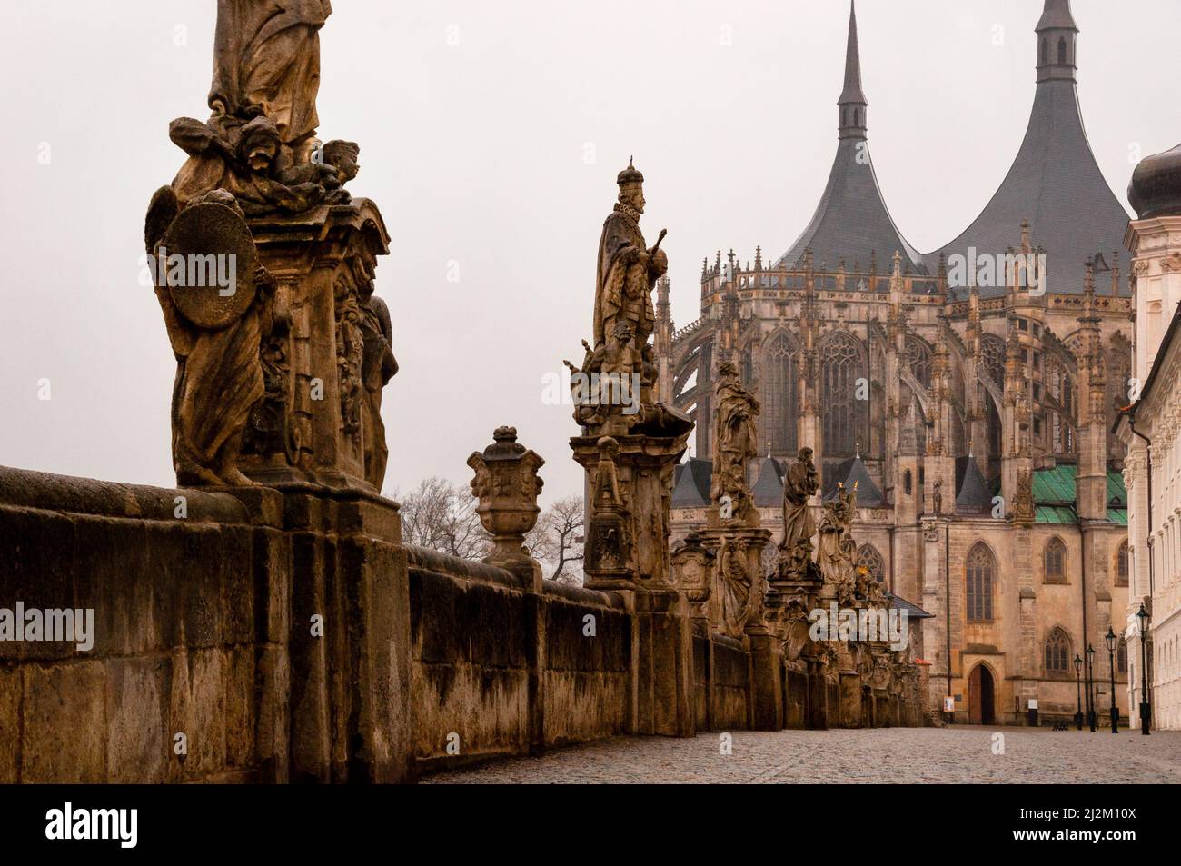 Neo-Gothic St. Barbara's Church in Kutná Hora with spired roofs, flying buttresses and Baroque statue lined approach, Czech Republic. Stock Photo