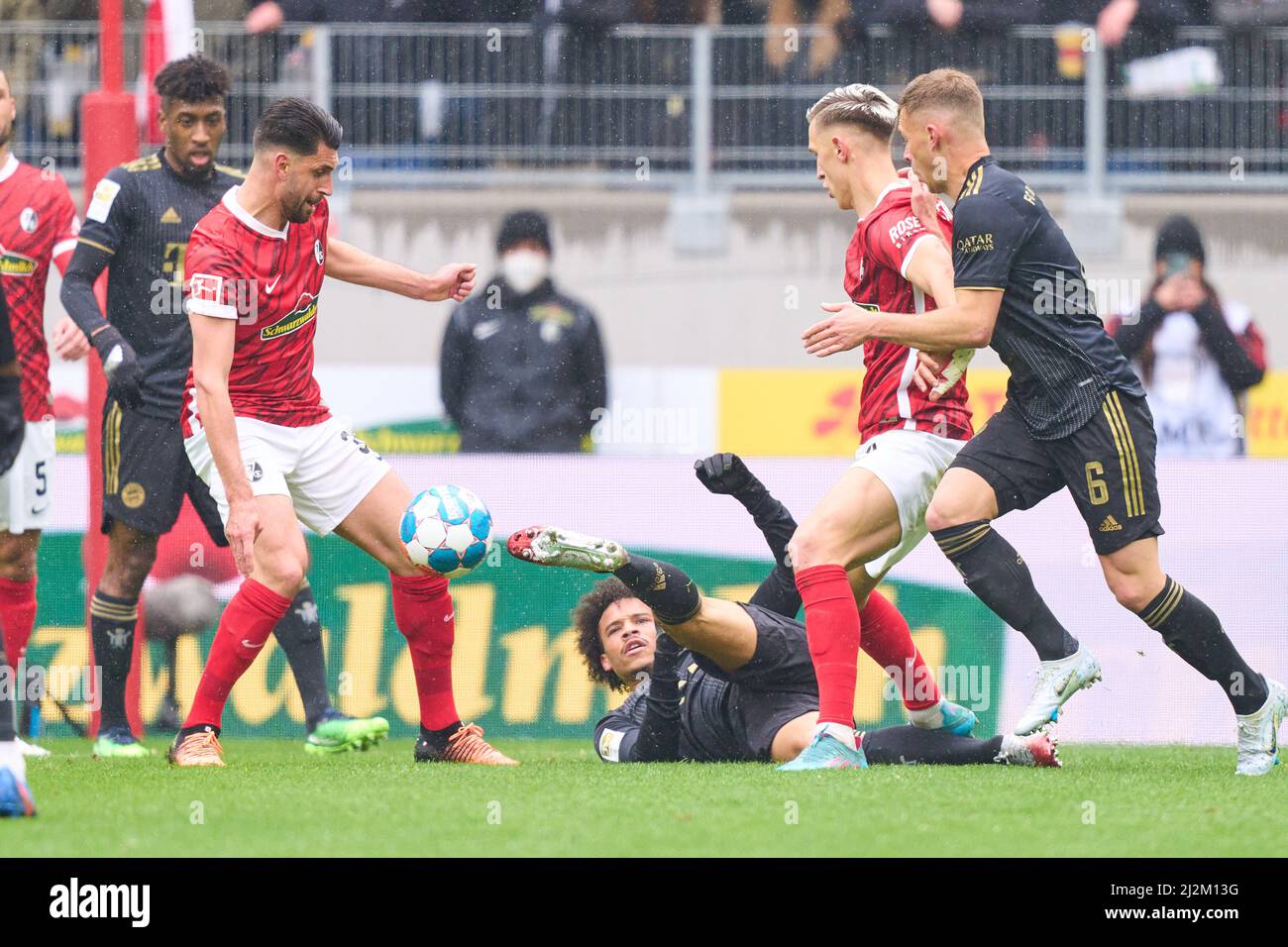 Freiburg, Germany. 02nd Apr, 2022. Leroy SANE, FCB 10  compete for the ball, tackling, duel, header, zweikampf, action, fight against Nico Schlotterbeck, FRG 4 Vincenzo GRIFO, FRG 32   in the match SC FREIBURG - FC BAYERN MÜNCHEN  1.German Football League on April 2, 2022 in Freiburg, Germany. Season 2021/2022, matchday 28, 1.Bundesliga, FCB, München, 28.Spieltag. FCB, © Peter Schatz / Alamy Live News    - DFL REGULATIONS PROHIBIT ANY USE OF PHOTOGRAPHS as IMAGE SEQUENCES and/or QUASI-VIDEO - Credit: Peter Schatz/Alamy Live News Stock Photo