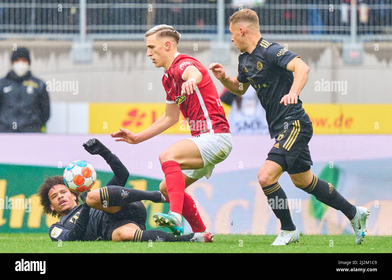 Freiburg, Germany. 02nd Apr, 2022. Leroy SANE, FCB 10 Joshua KIMMICH, FCB 6   compete for the ball, tackling, duel, header, zweikampf, action, fight against Nico Schlotterbeck, FRG 4  in the match SC FREIBURG - FC BAYERN MÜNCHEN 1-4 1.German Football League on April 2, 2022 in Freiburg, Germany. Season 2021/2022, matchday 28, 1.Bundesliga, FCB, München, 28.Spieltag. FCB, © Peter Schatz / Alamy Live News    - DFL REGULATIONS PROHIBIT ANY USE OF PHOTOGRAPHS as IMAGE SEQUENCES and/or QUASI-VIDEO - Credit: Peter Schatz/Alamy Live News Stock Photo