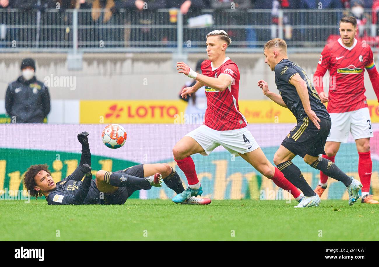Freiburg, Germany. 02nd Apr, 2022. Leroy SANE, FCB 10 Joshua KIMMICH, FCB 6   compete for the ball, tackling, duel, header, zweikampf, action, fight against Nico Schlotterbeck, FRG 4  in the match SC FREIBURG - FC BAYERN MÜNCHEN 1-4 1.German Football League on April 2, 2022 in Freiburg, Germany. Season 2021/2022, matchday 28, 1.Bundesliga, FCB, München, 28.Spieltag. FCB, © Peter Schatz / Alamy Live News    - DFL REGULATIONS PROHIBIT ANY USE OF PHOTOGRAPHS as IMAGE SEQUENCES and/or QUASI-VIDEO - Credit: Peter Schatz/Alamy Live News Stock Photo