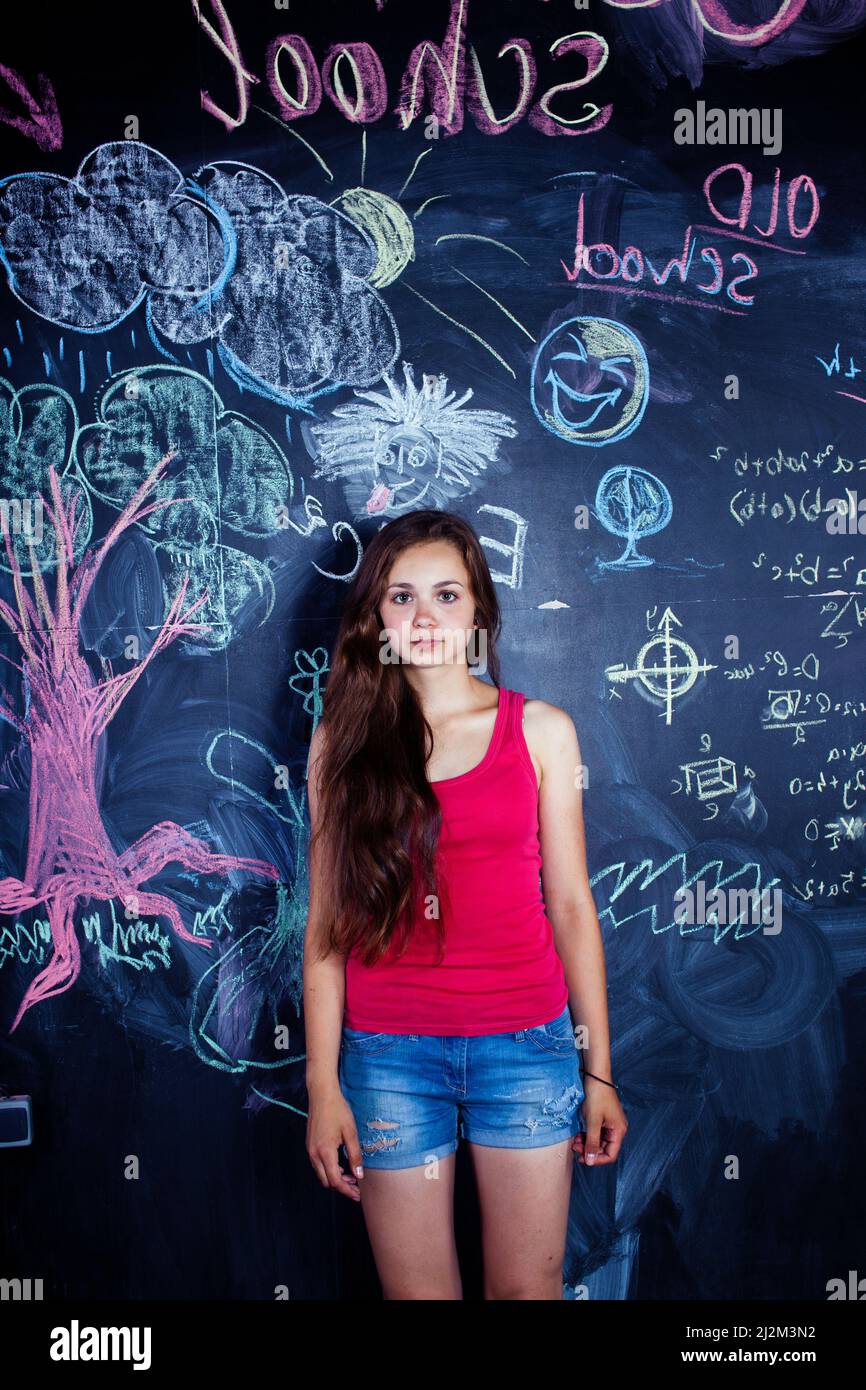back to school after summer vacations, cute teen girl in classroom ...