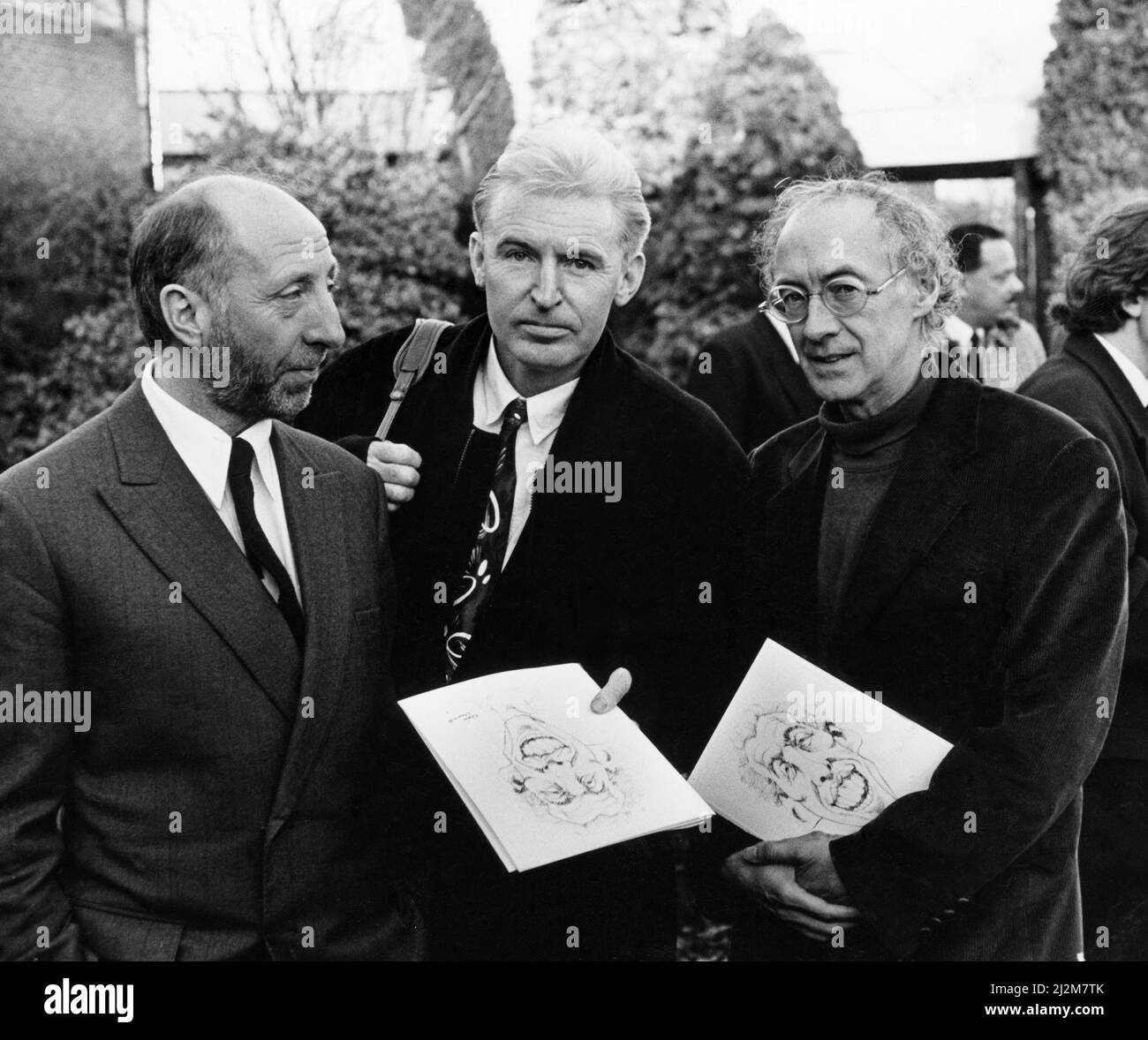 Together for the funeral of John Hewson at Springwood Crematorium are members of the former Liverpool pop group The scaffold: John Gorman, Mike McCartney (Mike MCGear) and Roger McGough.11th January 1991. Stock Photo