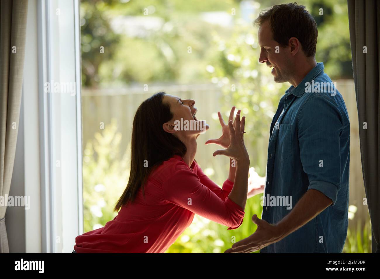 Fighting with fury. Shot of a mature couple having relationship problems at home. Stock Photo