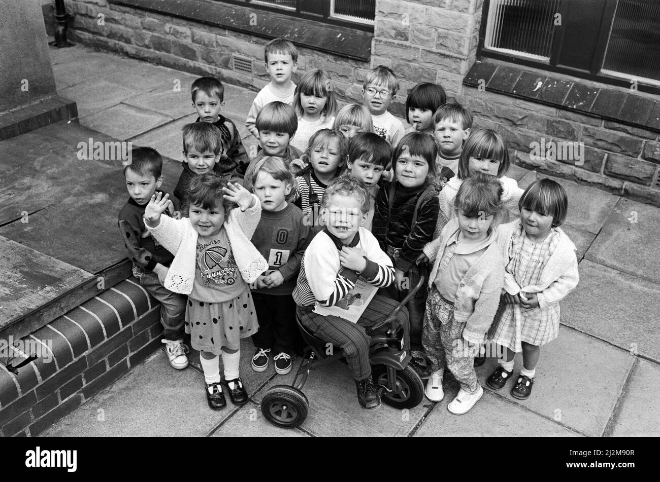 Three-year-old Timothy Stephenson crammed 113 objects in a matchbox to beat other members of Quarry Hill pre-school Playgroup, pictured, in a competition to raise funds. Timothy (pictured centre) and his friends raise £200 for the playgroup based at St Michael and St Helen's Church, Fleming House Lane, Almondbury. 5th June 1991. Stock Photo