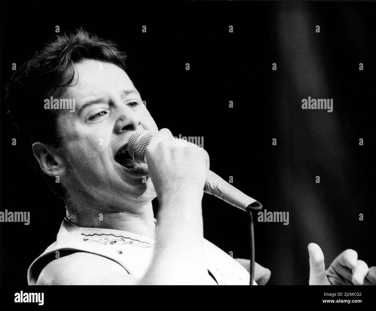 Jim Kerr, lead singer of the rock group Simple Minds entertains the