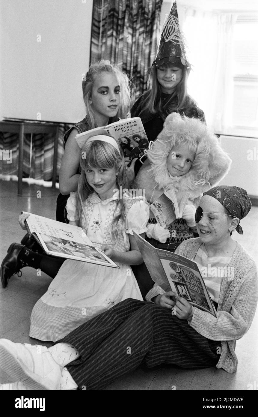 Children and staff at Linthwaite Church School dressed up as their favourite children's book characters to mark the end of the school's book week. Characters ranging from Alice in Wonderland to Batman and Robin took part in the event, which ended a week of competitions, displays and book review work. Pictured as their favourite characters are Melanie Davis (top left), Hannah Barton (bottom left) and (right from top) Rebecca Wittrick, Edward Hynes and Kirsty Ingham. 20th October 1989. Stock Photo