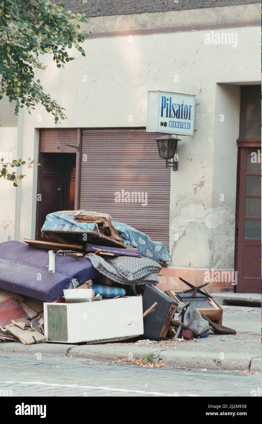 Furniture piled on street outside business which has recently closed in East Berlin, Germany 22nd September 1989.  Closure is due to the unsanctioned immigration of large numbers of East Berliners to the west. Stock Photo